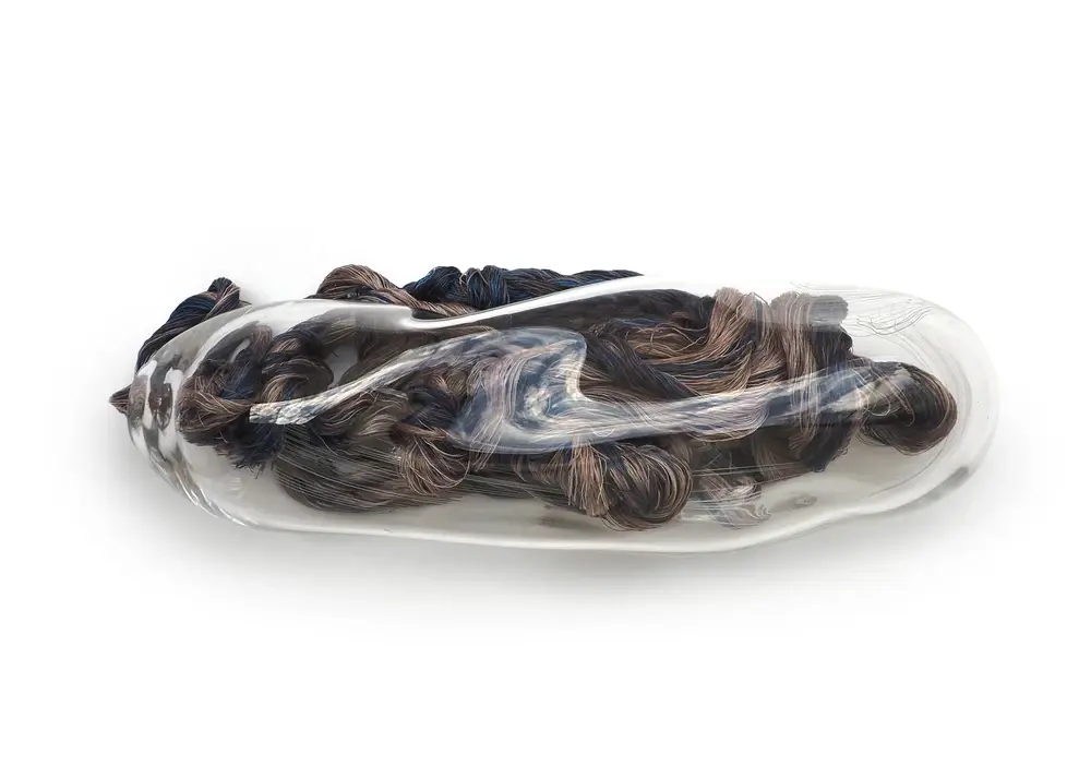 Blown glass cocoon with recycled fibers, insect extinction and metamorphosis, ecopoetics, Coco Brun.